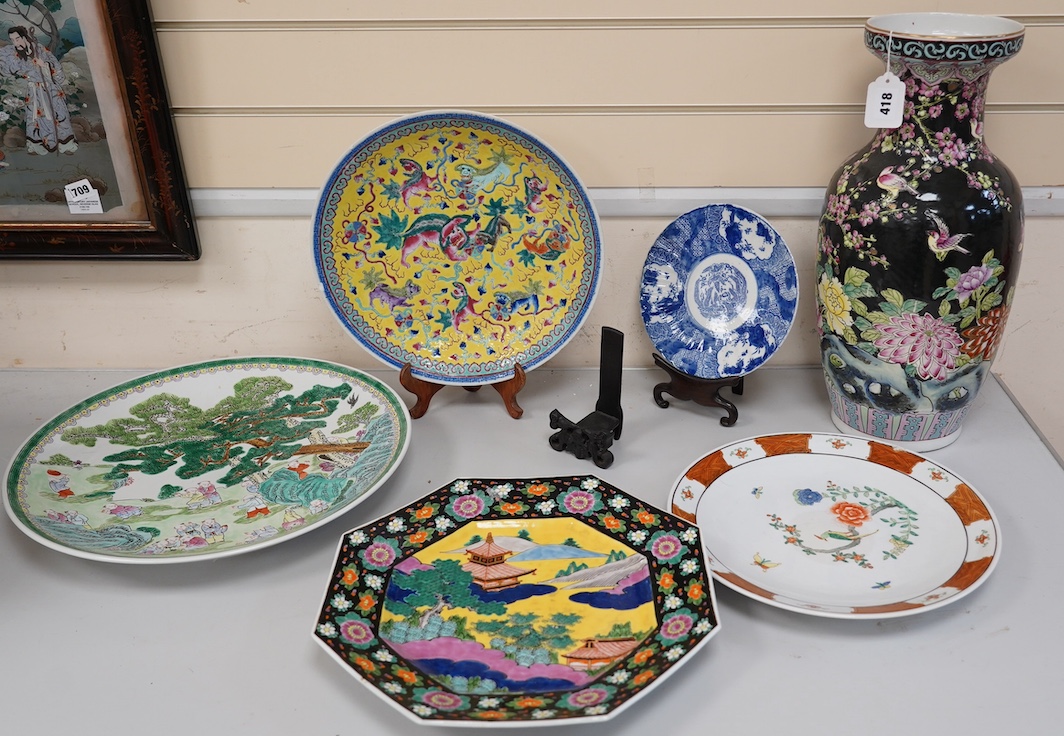Oriental ceramics to include a Chinese yellow ground charger and a large famille noire vase, 47cm high (6). Condition - yellow charger chipped on rim, bird plate, glaze browned near centre, other four items good